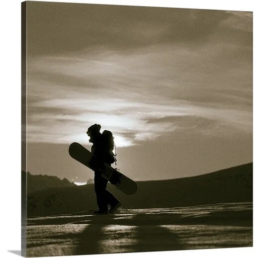 Christian Aslund Premium Thick-Wrap Canvas entitled Snowboarder walking through snow silhouetted