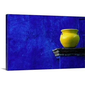 Douglas Steakley Premium Thick-Wrap Canvas entitled Yellow pot on stand against a blue stone wall